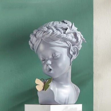 Cute Girl Kissing Butterfly Statue